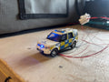 1:76 scale Oxford diecast Land rover police car with flashing lights