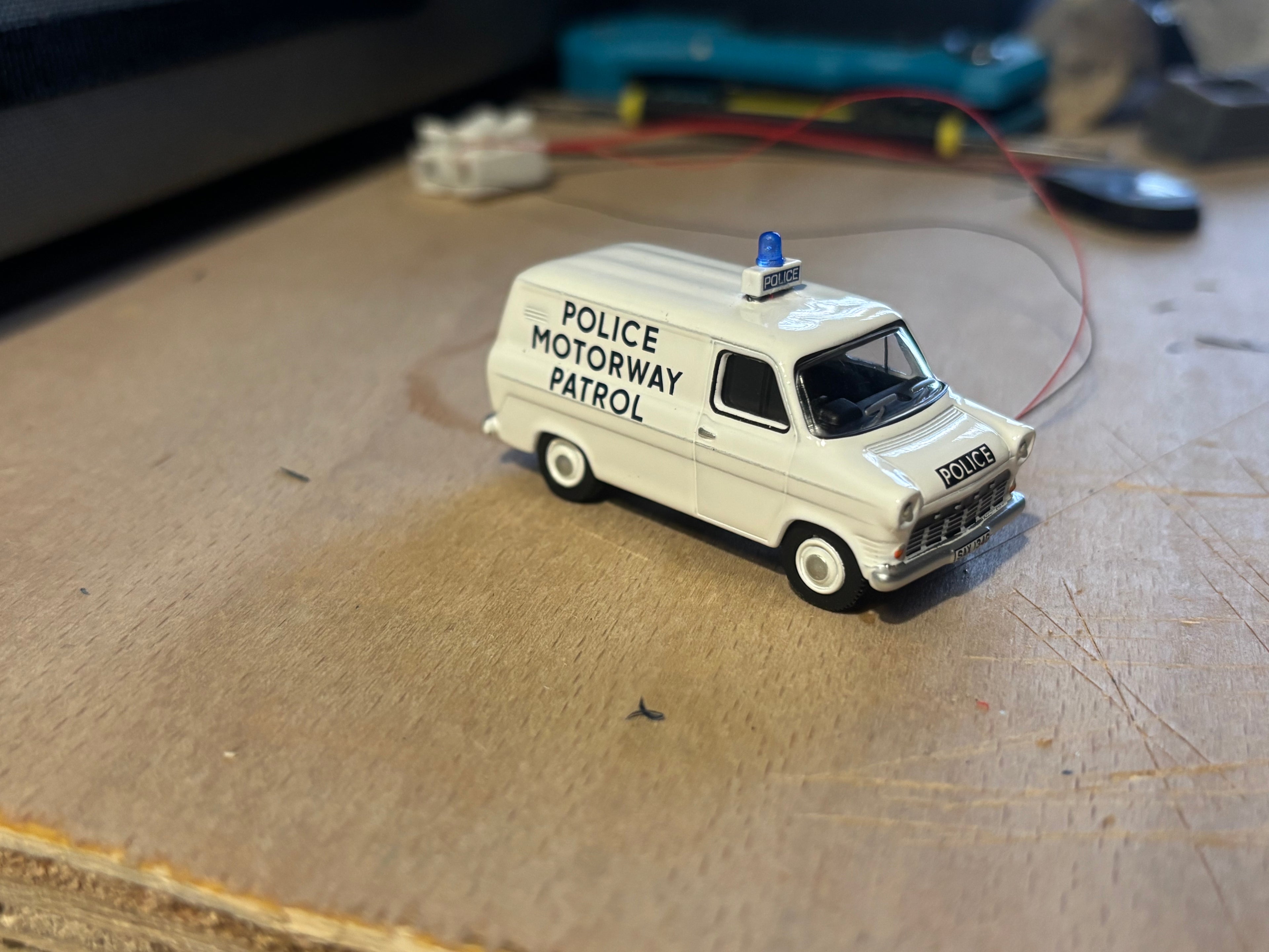 1:76 scale Oxford diecast Ford transit Mk1 police car with flashing blue lights