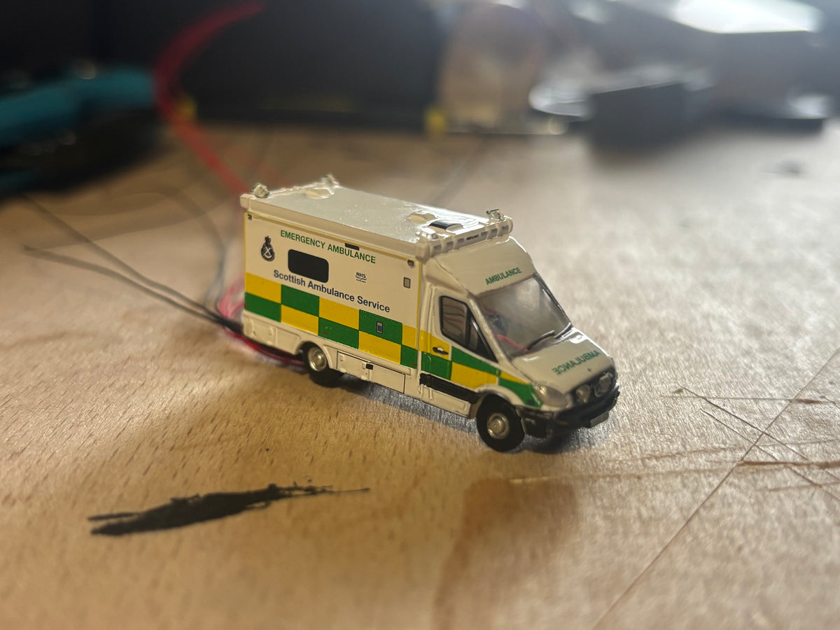 1:148 scale Oxford diecast Scottish ambulance with flashing lights