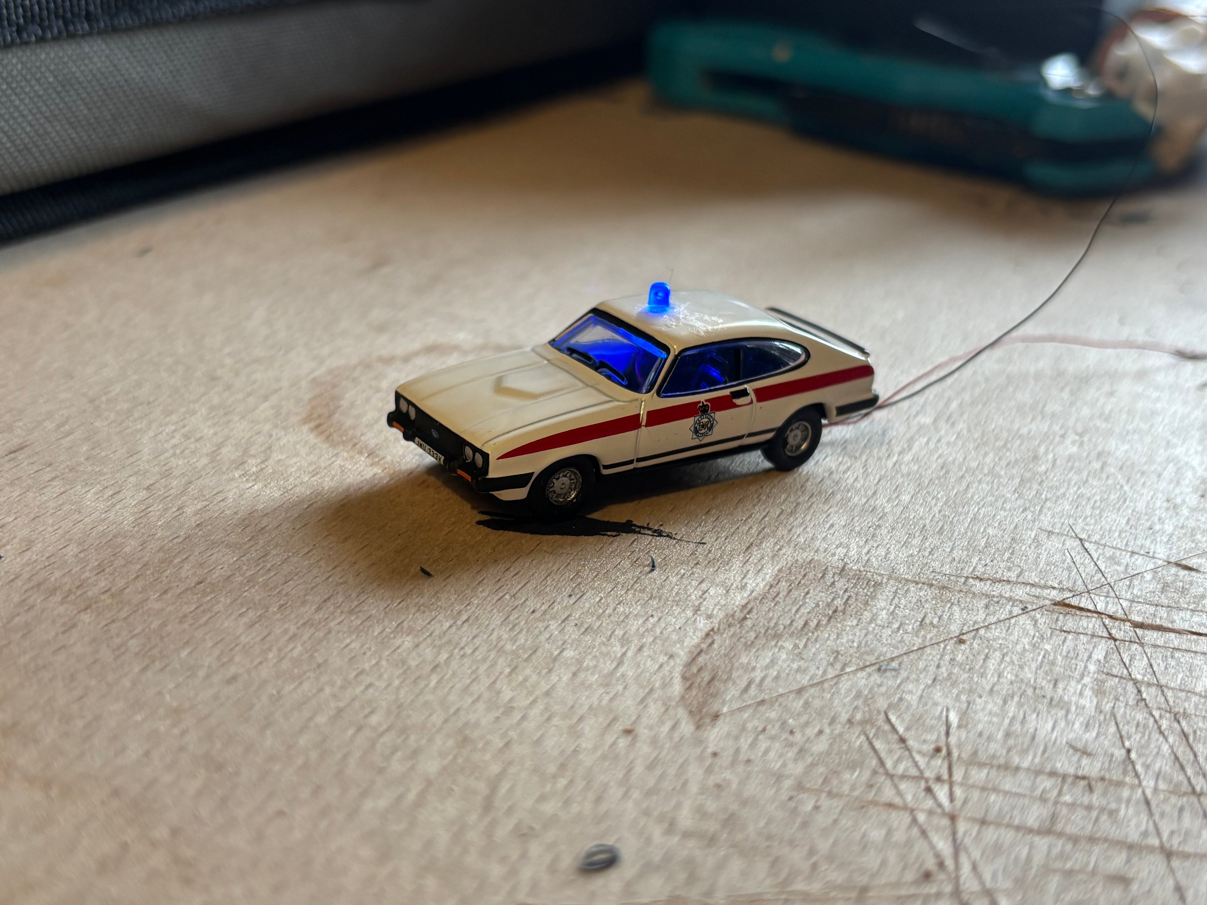 1:76 scale Ford Capri police car with flashing lights