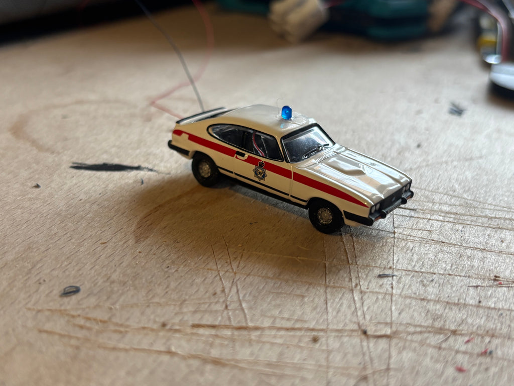 1:76 scale Ford Capri police car with flashing lights