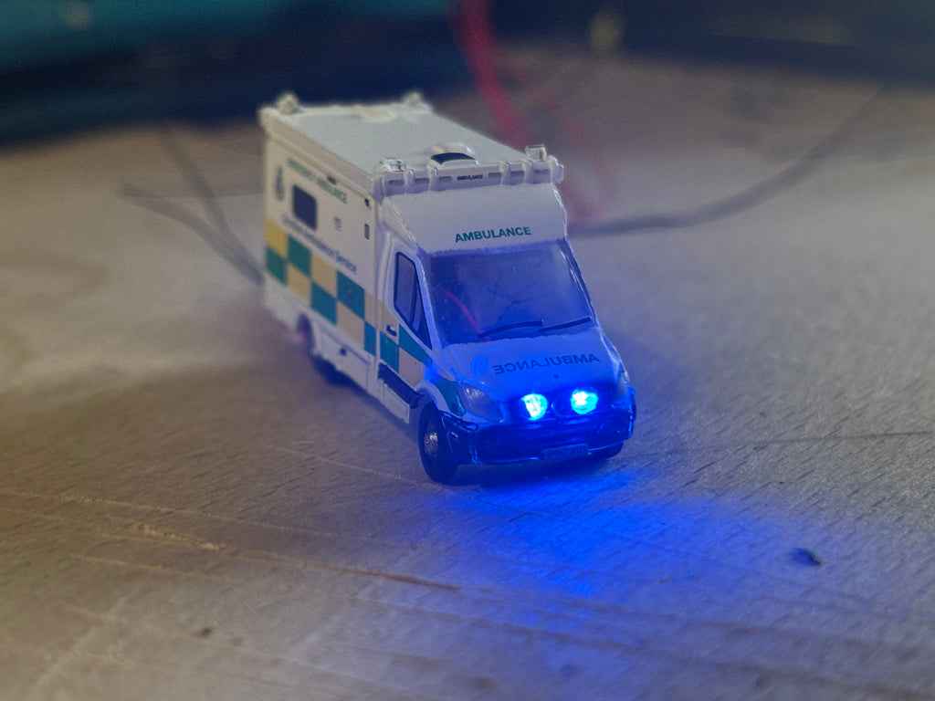 1:148 scale Oxford diecast Scottish ambulance with flashing lights