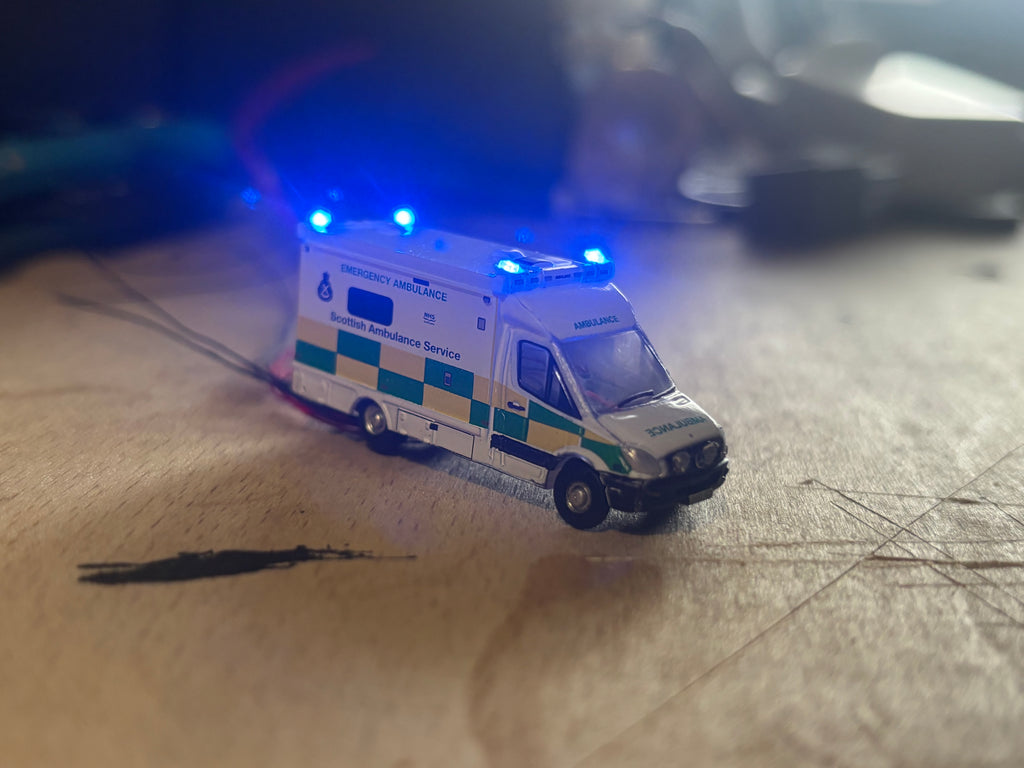1:148 scale Oxford diecast Scottish ambulance with flashing lights
