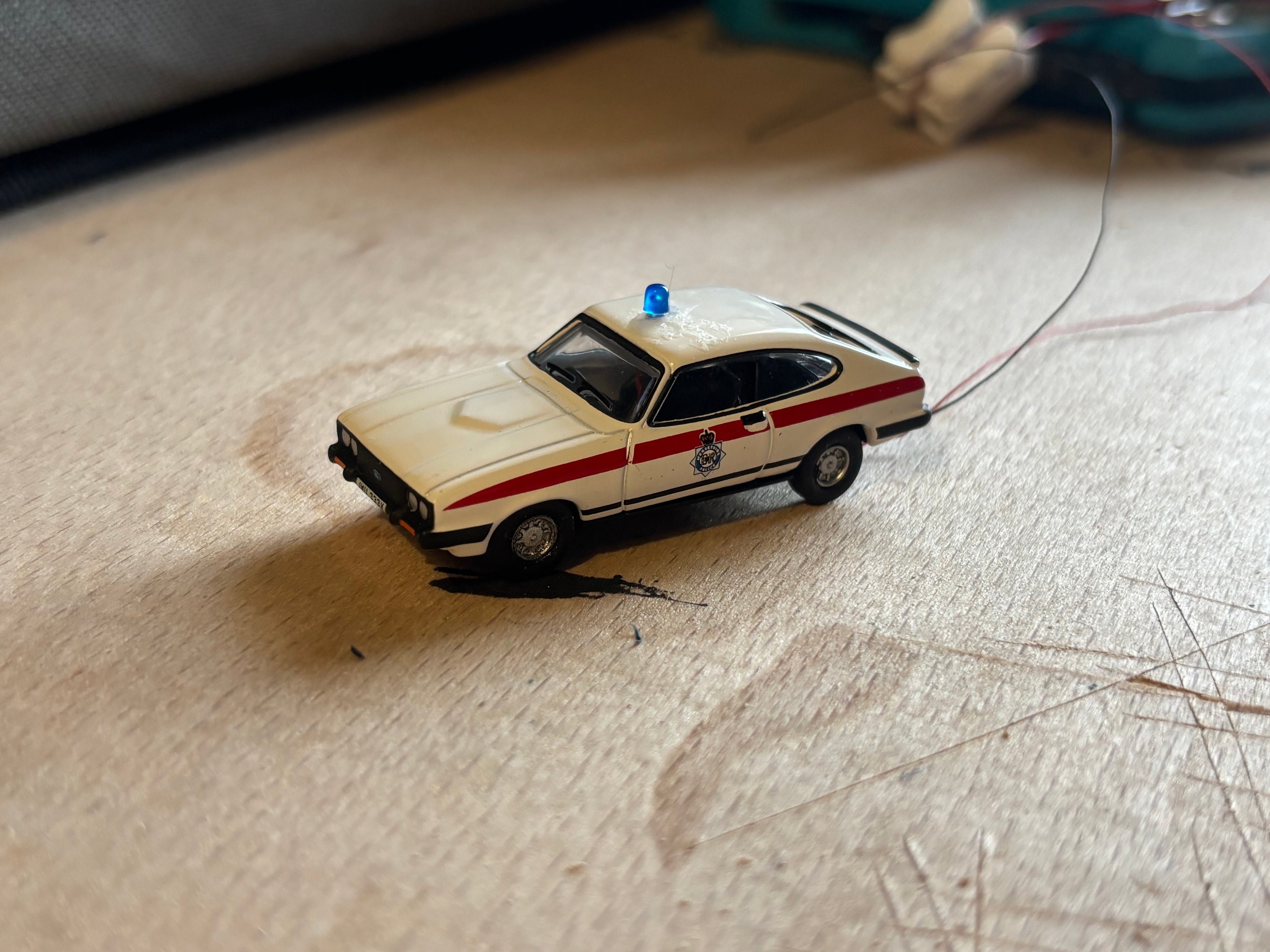 1:76 scale Ford Capri police car with flashing lights