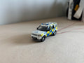 1:76 scale Oxford diecast Land rover police car with flashing lights