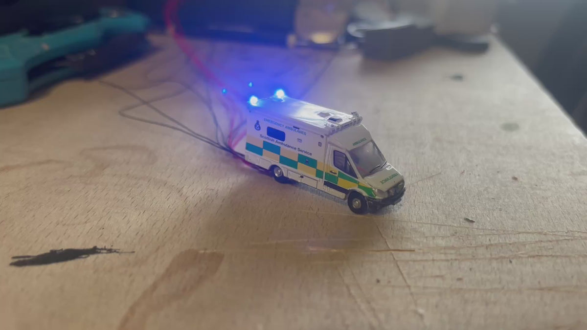 1:148 scale Oxford diecast Scottish ambulance with flashing lights