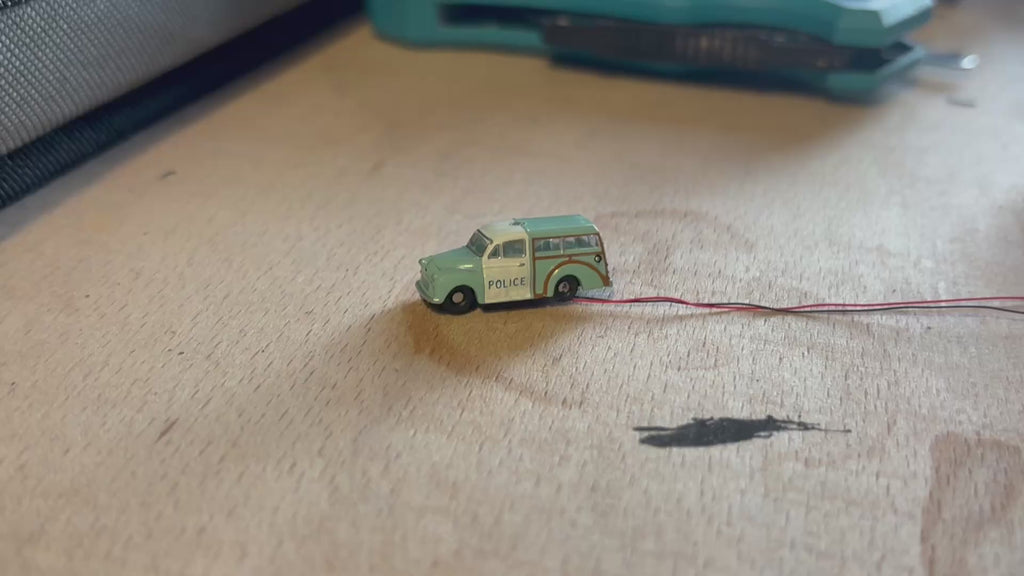 1:148 scale Oxford diecast Morris minor police car with flashing lights