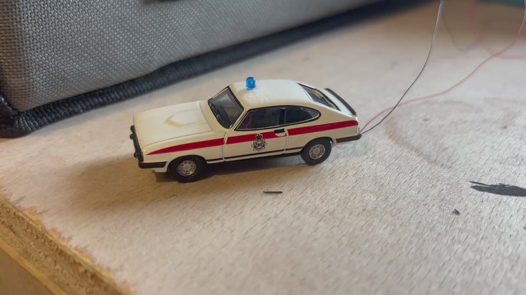 1:76 scale Ford Capri police car with flashing lights