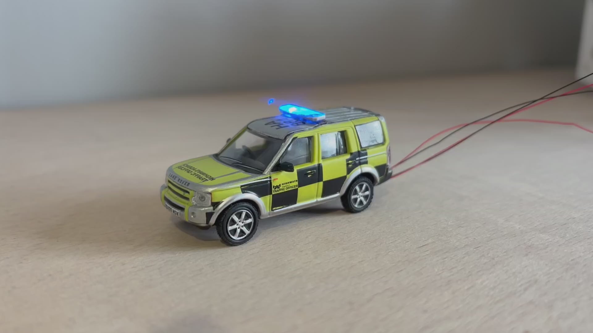 1:76 scale Oxford diecast highway patrol with blue flashing lights